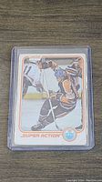 Front view of the 1981 O-Pee-Chee Wayne Gretzky Super Action hockey card showing Gretzky skating in Edmonton Oilers uniform with 'Super Action' label and team logo.