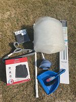 Photo showing entire lot of housewares outside on grass, capturing all items from an angled top view.