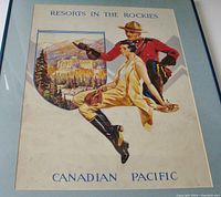 Framed vintage Canadian Pacific Resorts In The Rockies poster featuring Mountie, woman, and Banff Springs Hotel illustration.