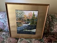 Framed acrylic painting of an old mill with autumn trees and water, showing full artwork and frame.