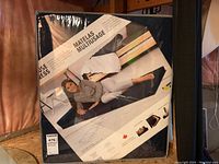 Image showing the multi-use pillow mattress in original packaging with a person lying on it.