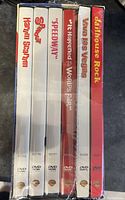Side view of 6 DVD spine titles including Flaming Star, Spinout, Speedway, It Happened at the World's Fair, Viva Las Vegas, Jailhouse Rock.