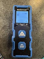 Front view of Mastercraft laser distance measurer showing device display and control buttons.