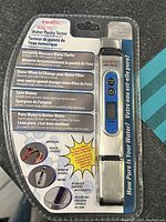Front view of the digital water purity tester, showing the device in retail packaging with branding, product features, and sensor probe visible.
