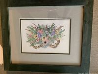 Framed floral watercolor artwork showing full view of frame and print.