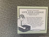 Front of the packaging showing product use and TSA compliance information for a set of two travel combination locks.