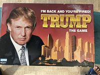 Game box with large image of Donald Trump and a city skyline background with game title text.