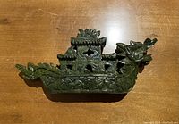 Top view of the carved jade dragon boat showing the roof and dragon head details.