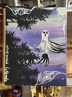 Full view of the 'Spirit World' painting showing central bird figure, dark tree silhouettes, and moon in purple-blue night sky.