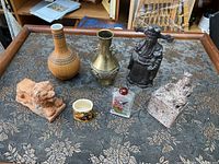 All six Chinese decorative items on floral cloth tray, showing full lot.