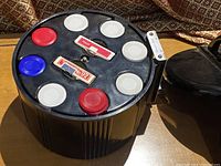 Top view showing the black Bakelite chip carrier container holding red, white, and blue poker chips along with two dealer buttons labeled 'POKER' and 'No. 92'.