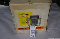 Original box with image and details of Vernon 707 8mm Movie Editor showing product features and condition.