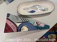 Abstract painted ceramic wall sconce in triangular shape with colorful modern art design