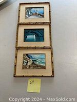 Three framed oil paintings vertically aligned, showing Italian scenic views