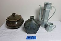 Full view of the 5-piece ceramic lot showing the stew pot with lid, EAS Japan tall pitcher, matching creamer, and a uniquely shaped handcrafted vase.