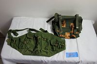 Both green canvas bags photographed on white surface, showing overall size and pouch layout