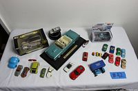 Overview of all diecast and toy cars laid flat on table with identification marker #42