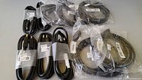 10 DisplayPort cables shown coiled and some packaged with labels