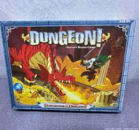 Front of the box showing Dungeon Fantasy artwork of dragon and adventurer in a dungeon.