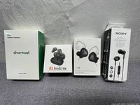 Four boxed items: Charmast power bank, IQ Budz 07 earbuds, ZST dual driver earbuds, Sony MDR-EX110AP wired earbuds