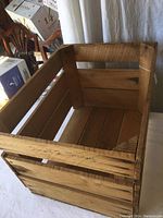 Top view of sturdy wooden crate showing interior and wood slats construction