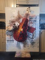 Front view of large decorative giclee painting showing musical instrument and chair theme with vibrant red cello and abstract background.