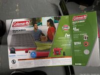 Photo showing front and top of Coleman Quickbed Plus queen air mattress box highlighting product details and features