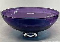 Side view showing the deep purple color and round shape of the bowl on its clear pedestal foot.