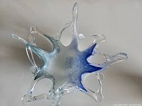 Top view showing interior and color gradient from blue to clear glass with ocean wave pattern.