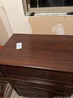 Top view of the dresser showing wood grain and surface condition