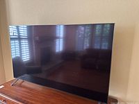 Front view of 65-inch LG NanoCell TV on central stand