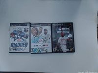 Front cover image of three sports games for PlayStation 2: Madden NFL 2001, FIFA Soccer 09, MLB 08 The Show.