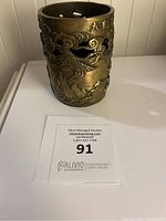 Front view of bronze rush pot showing detailed cut-out dragon design and Chinese engraving near rim.