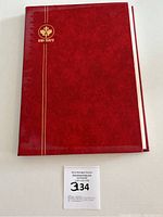 Front cover of red Uvi-Safe stamp album with no visible wear.