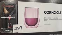 Photo of the boxed set showing Corkcicle stemless double-walled wine glasses and Rabble aerating pourer packaging.