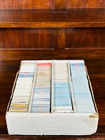 Photo of entire box filled with sports cards organized in rows