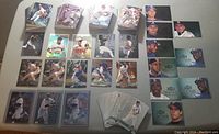 Lot laid out showing multiple stacks and rows of 1996 Fleer Metal Universe Debut baseball cards including base cards and inserts with action and posed images.