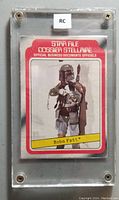 Front view of Boba Fett rookie card from 1980 O-Pee-Chee Star Wars series inside clear protective case with label 'RC'