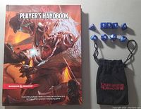 Front cover of the Dungeons & Dragons Player's Handbook with nine blue polyhedral dice and black drawstring dice pouch with logo.