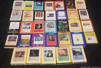 Top view showing the full lot of 8-track tapes with visible album covers and labels.