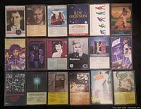 Full view of 12 cassette tapes showing front cover art and labels in plastic cases arranged in rows.