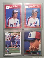 Four vintage baseball cards of Larry Walker, each in plastic sleeve, showing Montreal Expos uniforms and rookie card labels on two cards.