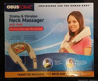 Front view of the sealed Obusforme Neck Massager box showing product name, brand, features including deep kneading, vibration, heat, rotating massage mechanism, and targeted massage for neck and shoulders.