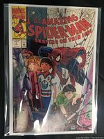 Photo of The Amazing Spider-Man Skating on Thin Ice #1 comic book cover showing Spider-Man and children.