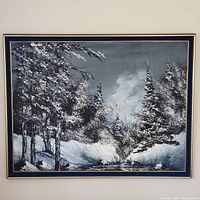 Full view of large oil painting framed, featuring a snowy forest landscape with pine trees under a gray sky.