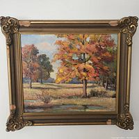 Front view of autumn landscape oil painting in ornate gilt wood frame