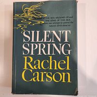 Front cover with original dust jacket showing title Silent Spring and author Rachel Carson.