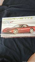 Original box of the radio controlled Corvette 50th Anniversary model car, showing red car image and branding on front.