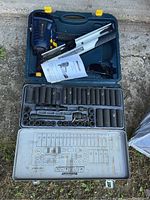 Mastercraft framing nailer and socket set in a plastic carrying case, showing the nailer on the left and socket set below