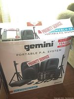 Sealed Gemini ES-210MXBLU-ST box showing model, speakers, mixer and stands graphics